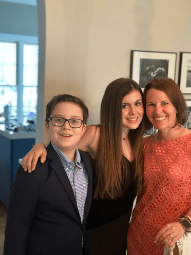 A group of people posing for the camera

Description automatically generated