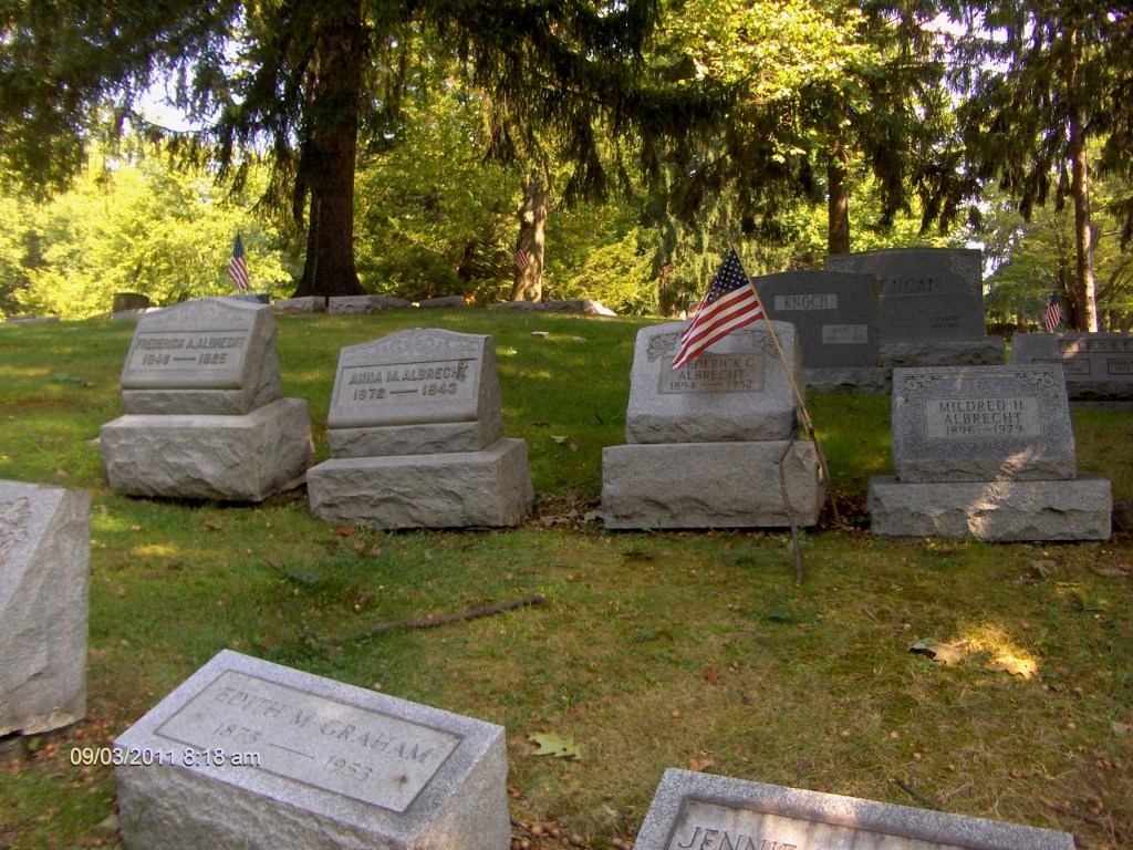 A sign in the middle of a park

Description automatically generated