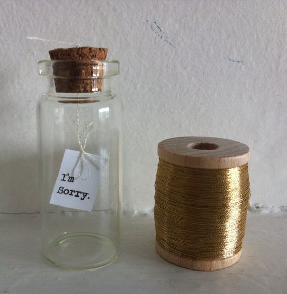 A picture containing indoor, table, cup, sitting

Description automatically generated