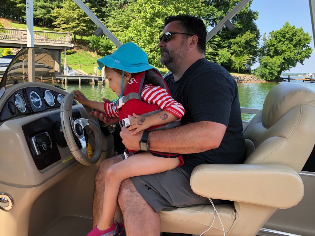 A person sitting in a car

Description automatically generated