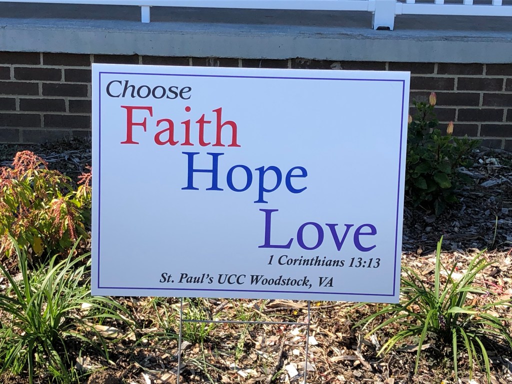 A sign on the side of a building

Description automatically generated